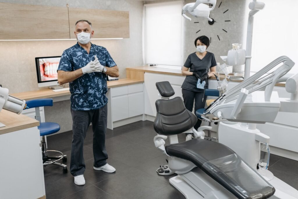 Dentist examining a patient at a dental clinic in Toronto for bleeding gums