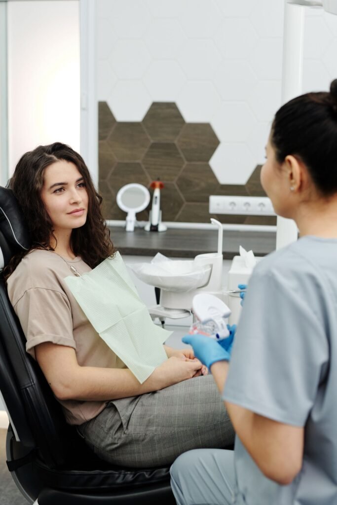 Dentist placing a tooth coloured composite filling at a dental clinic in Toronto
