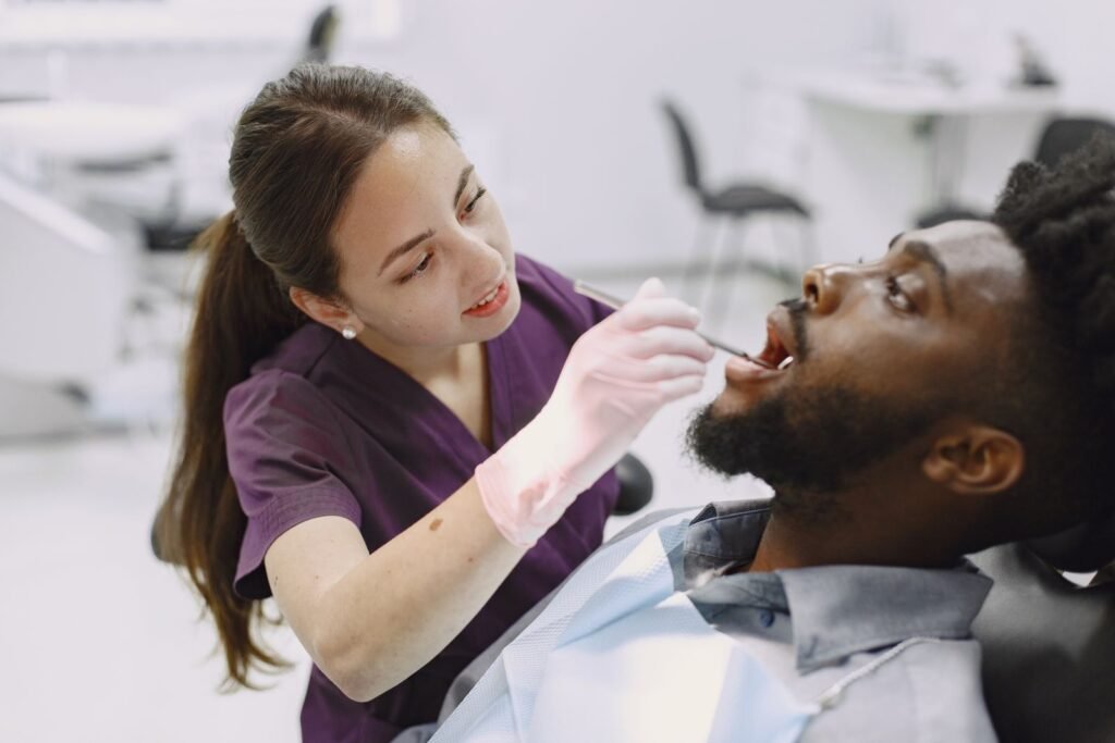 Dentist explaining dental bridge and dental implant options to a patient in Toronto