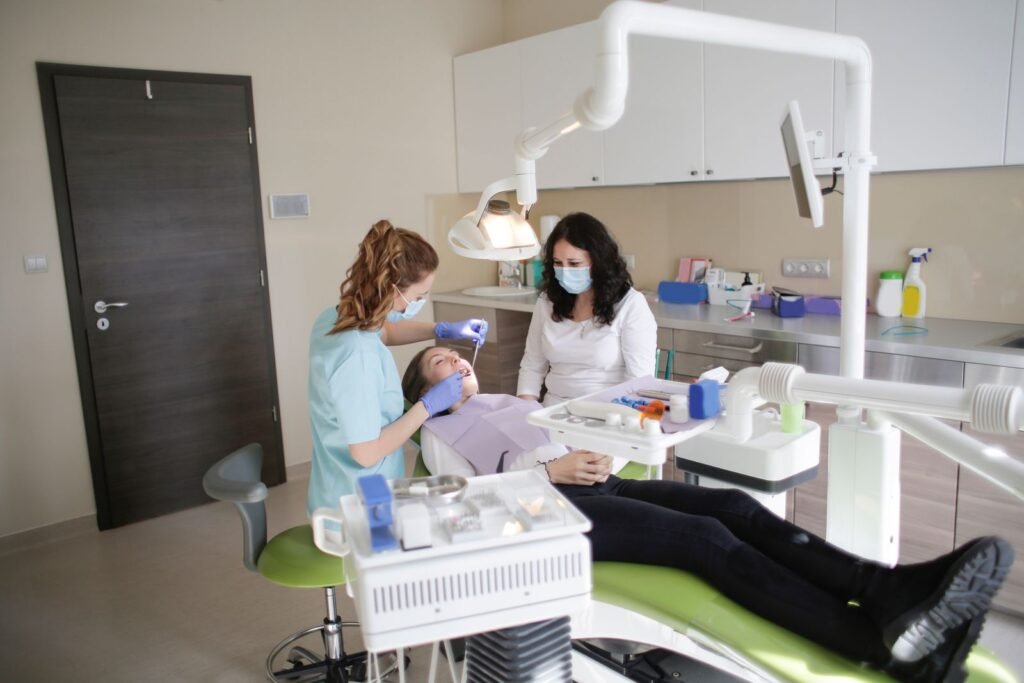 Cosmetic dentist comparing veneer shade options at a dental clinic in Toronto